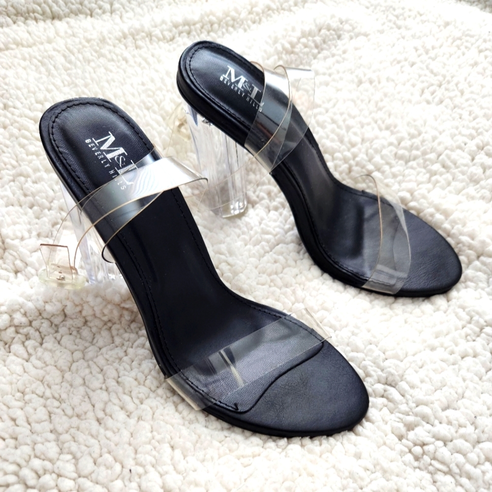 Brand new. Size 7.5 Clear Strappy Heels